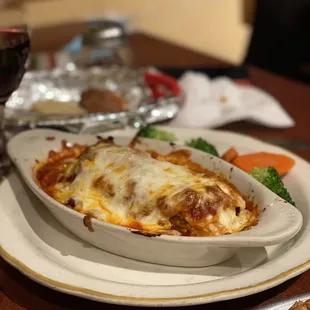 a plate of food and a glass of wine