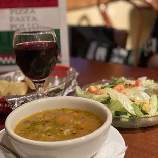 a bowl of soup and a plate of salad