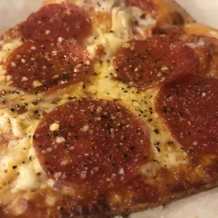 Pepperoni  by the slice! Nom nom   little  n pepper on top.  Cheese  Pizza