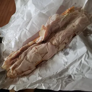 two pieces of meat on a piece of paper