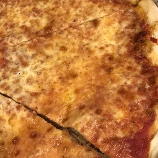 a cheese pizza cut into four slices