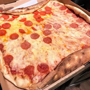 Pie so big that it barely fits in the box.