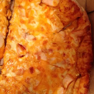 Only a few pieces of chicken on each slice.