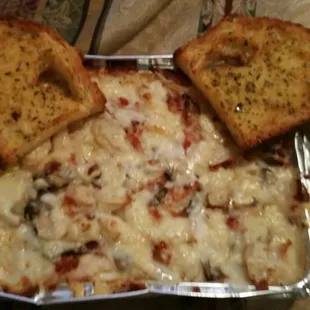 Chicken carbonara with baked chicken, linguini noodles, mushrooms, onions, bacon, creamy alfredo sauce plus extra meat and sauce.