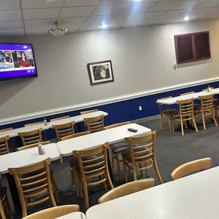 an empty restaurant with tables and chairs