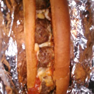 Meatball Sub (Well done as requested)  2 meatballs cut in half.