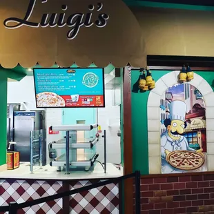 a sign for luigi's pizza