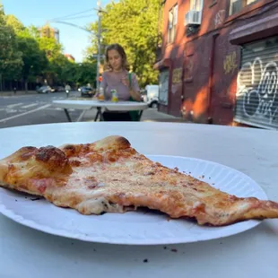 Plain cheese pizza slice, $2.75 + tax + tip