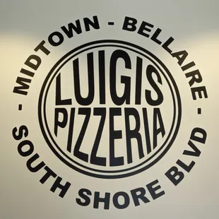 the logo on the wall