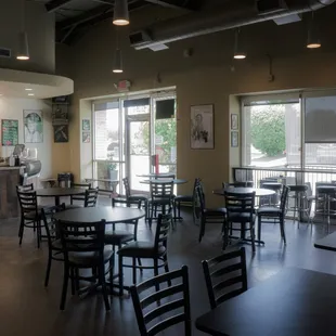 a restaurant with tables and chairs