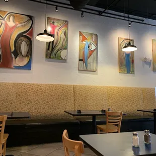 a dining area with tables and chairs