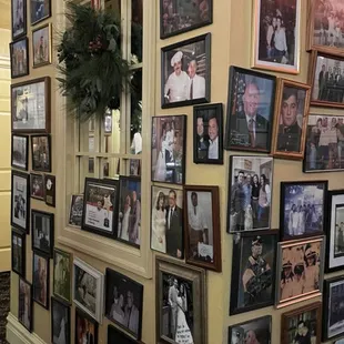 a wall of family photos