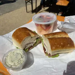 Tina's Italian Sub Specialty Sandwich , potato salad, fruit cup