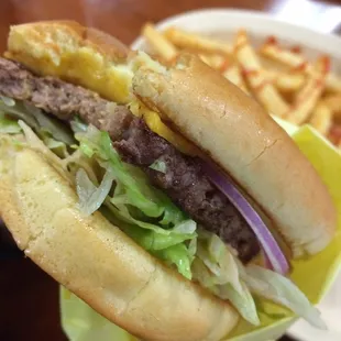 a hamburger and fries on a plate