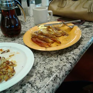 French toast with bacon and a side of hasbrowns