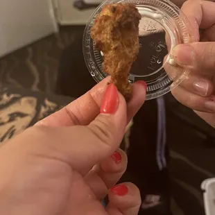 Chicken wing. Next to the ranch lid to see size comparison