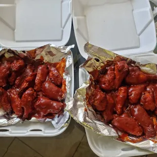 two trays of chicken wings