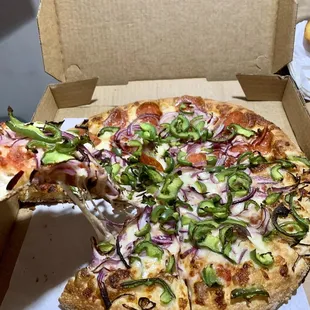 Medium pizza with onions, green peppers and pepperoni on half.