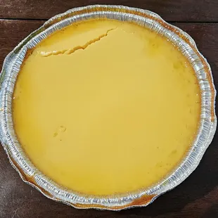 a pie in a tin on a wooden table