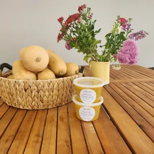 a basket of gourds and a cup of yogurt