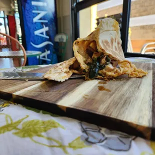 a wooden cutting board with food on it