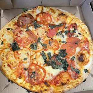Create Your Own Pizza add basil and tomato