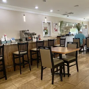 a restaurant with tables and chairs