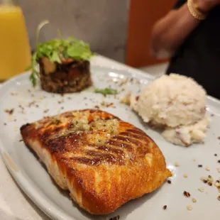 a plate of fish and mashed potatoes