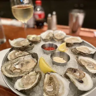 Dozen LA Gulf Oysters and a glass of Riesling.