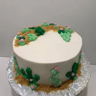 a cake decorated with cactus
