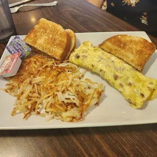 Senior breakfast - ham and cheese omlette with hashbrowns, toast and juice
