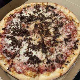 Pizza with sausage??? Looks more like burnt bacon bits to me