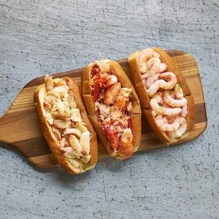 Our rolls are served Maine-style with 4oz/6oz of chilled seafood on a toasted bun with a swipe of mayo, lemon butter, &amp; our secret seasoning