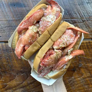 Our seafood rolls are served Maine-style: chilled lobster with a swipe of mayo, lemon butter, and Luke&apos;s Secret Seasoning