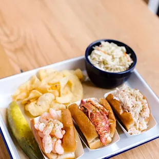 Our Luke&apos;s trio is the ULTIMATE seafood sampler. Don&apos;t forget the chips and slaw for the full experience