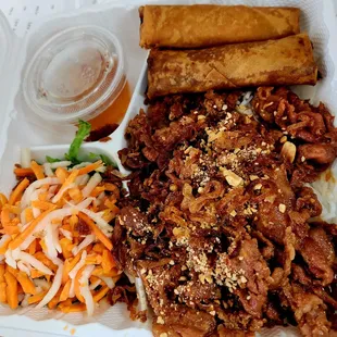Vermicelli noodle, grilled pork, egg roll, peanuts, fried shallot, pickled daikon/carrots, sweet chili fish sauce.