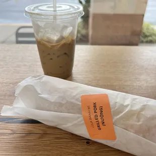 a cup of coffee and a wrapper