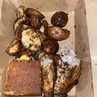 Combo # 1 chicken with white meat, roasted potatoes, and cornbread.