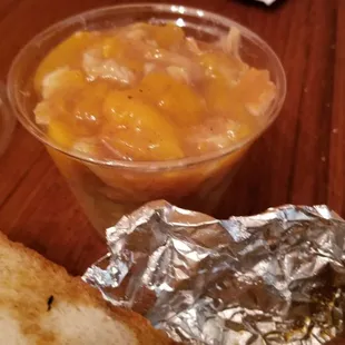 a grilled cheese sandwich with a side of fruit