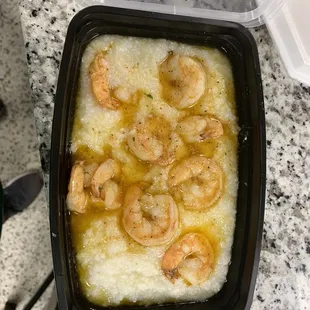 a bowl of shrimp and grits