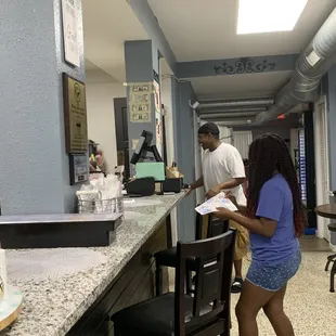 a woman standing at the counter