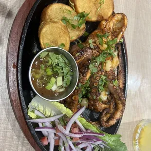 Octopus- sauce has some heat, recommend dipping a small bit before pouring it all over.