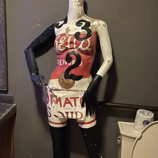 a mannequin dressed in a bathroom
