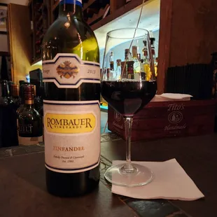 a glass of wine and a bottle of wine