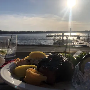 a plate of food and a glass of water