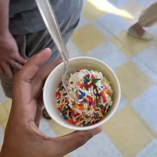 a bowl of ice cream with sprinkles