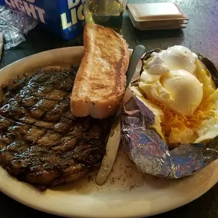 14oz ribeye, potato, and bread. Perfectly to the point!