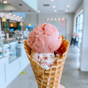 Double scoop with watermelon lime sorbet and Earl Grey Blackberry  on a brown butter waffle cone