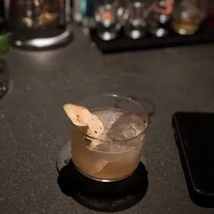 a drink in a glass on a table