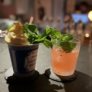 a cup of ice cream and a drink